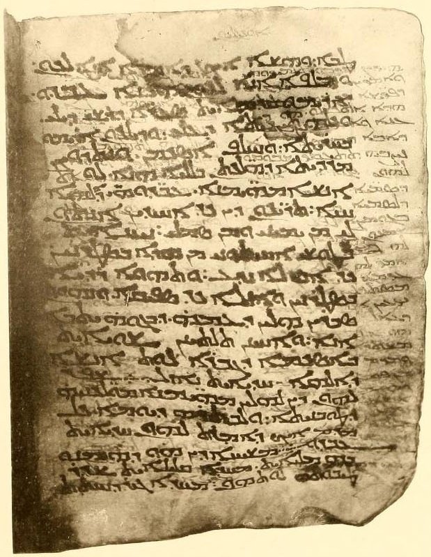 Folio 21v of the Sinaitic Palimpsest showing Old Syriac text of Matthew 15 visible beneath the overwriting saints' lives.